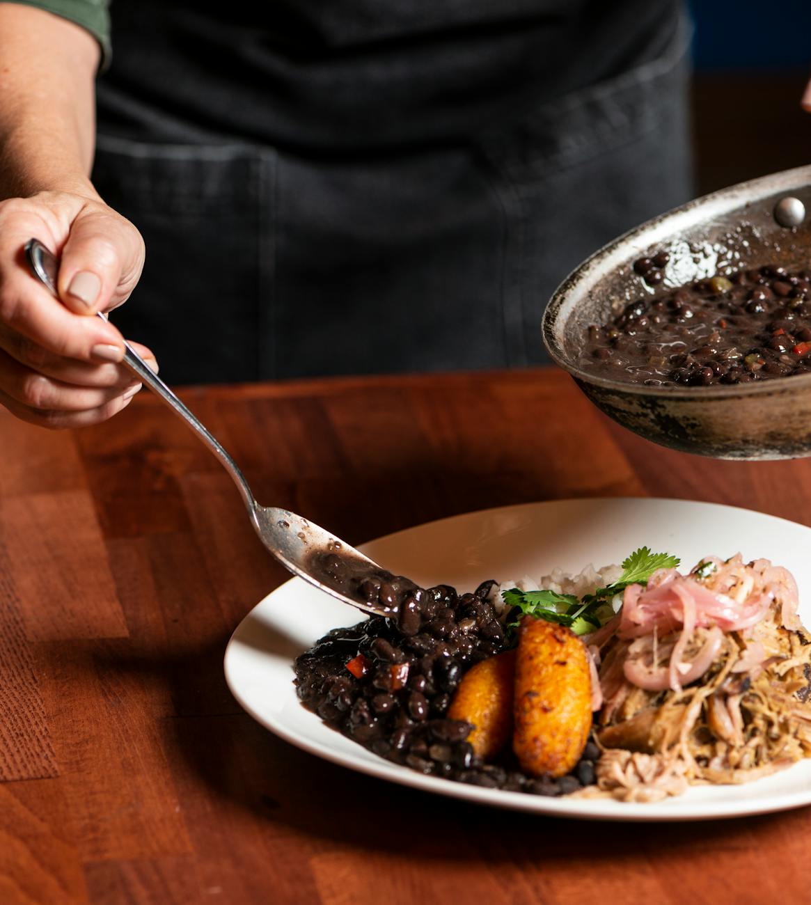 pexels-photo-29850458 flavorful cuban cuisine with black beans